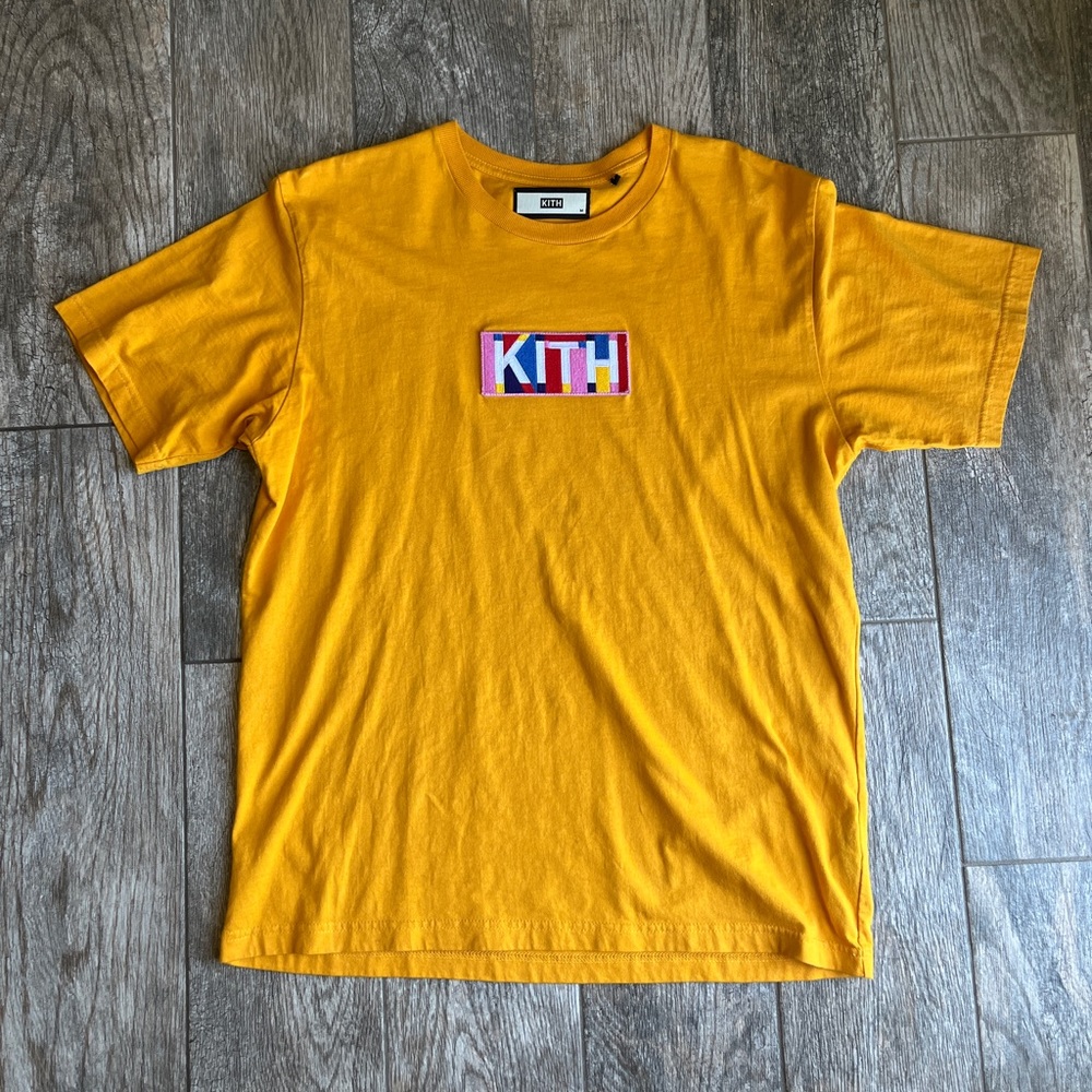 Kith Geo tee in deep yellow with bright logo. Great condition!